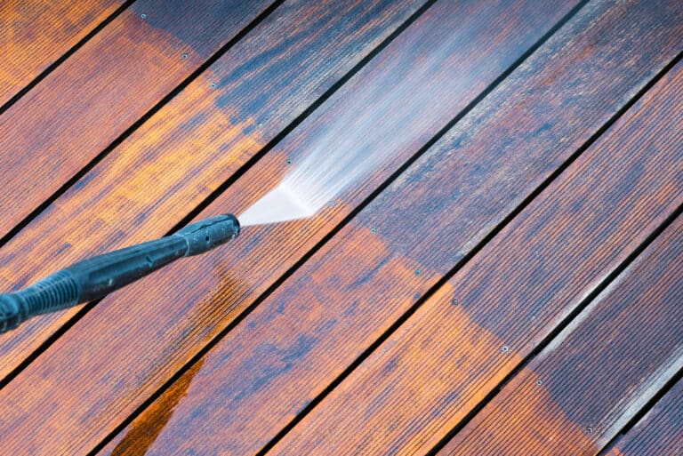 how to clean composite decking- pressure washing with the grain