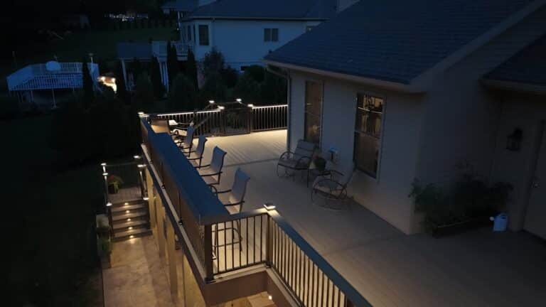 nighttime photo of the Millersburg PA custom deck installation by Upper Dauphin Vinyl Products emphasizing on the lighting