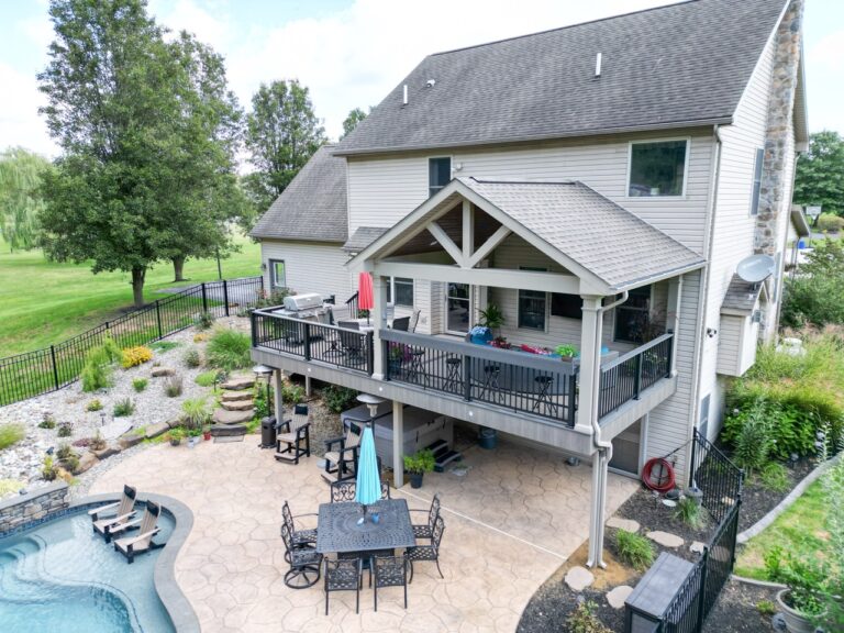 a deck with a roof by a pool in colonial park PA