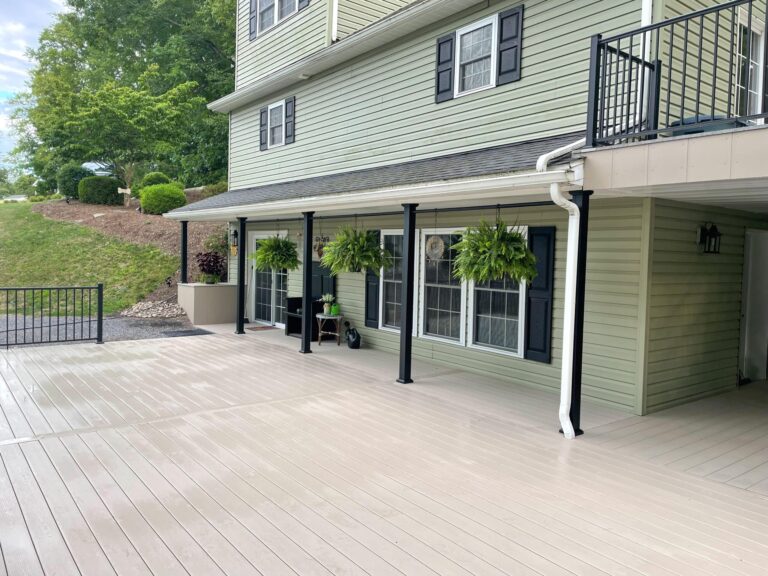 a brand new beige deck installed for a light green house in york pa