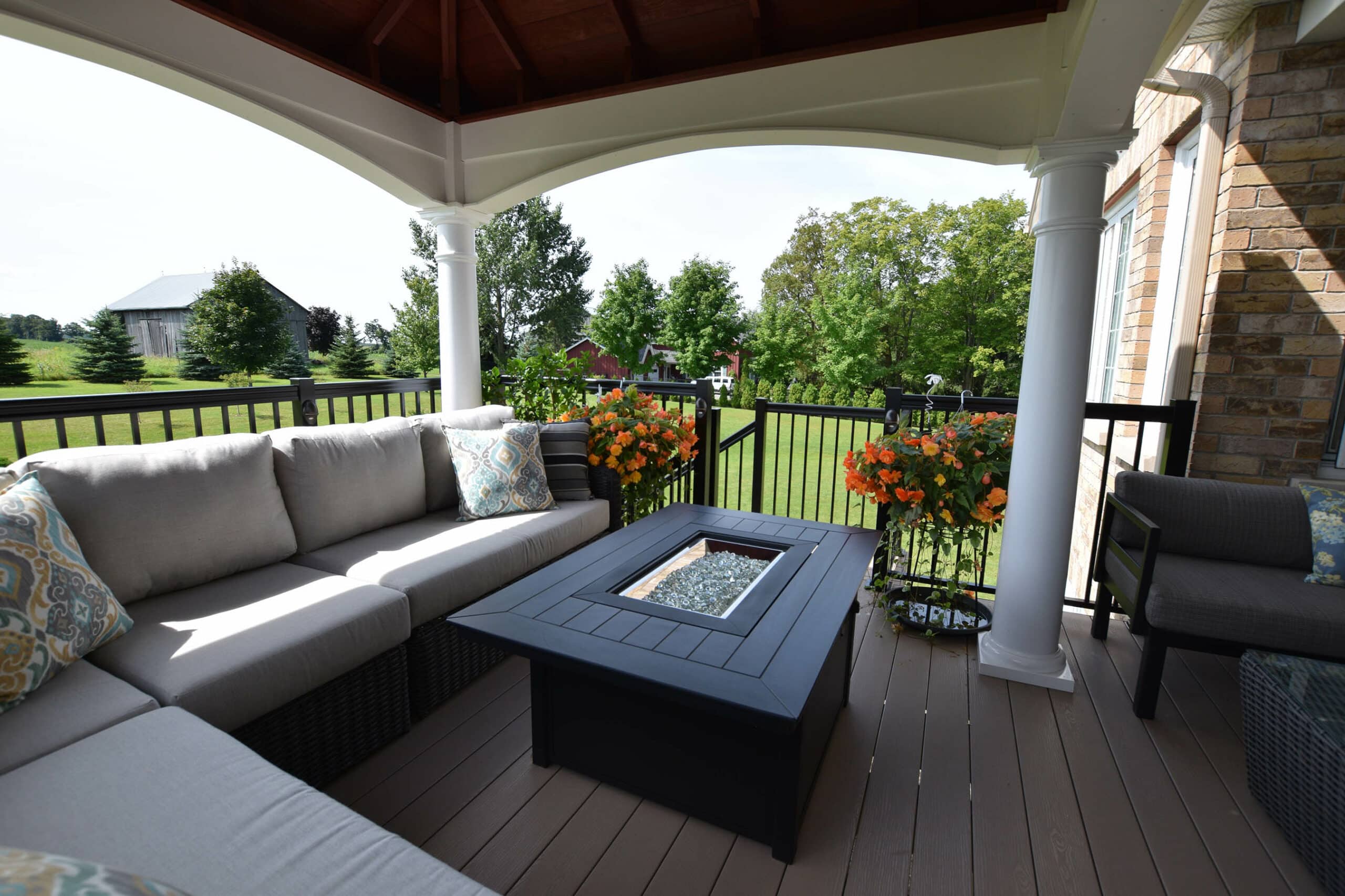 a deck with couches and a pavilion to block out the sun in york pa