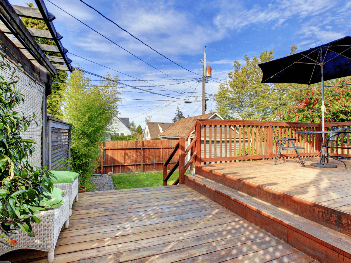 Wood deck railing on a backyard deck