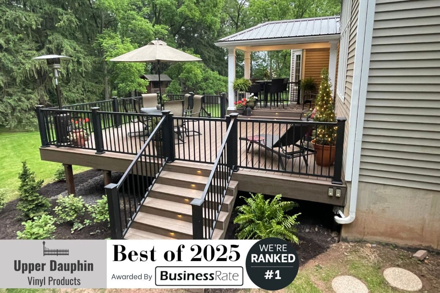 Upper Dauphin Vinyl Products named Best Deck Builder in Elizabethville. View of completed deck project with banner announcing #1 placement by Business Rate