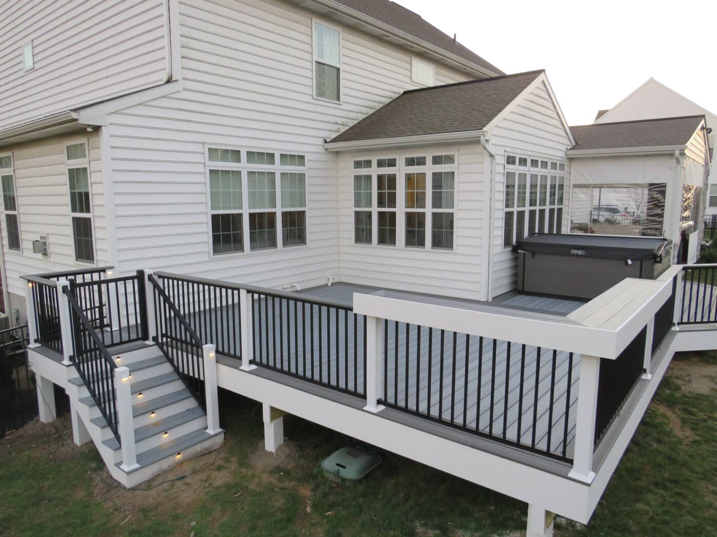 bar on the corner of a vinyl deck railing