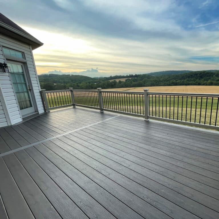 gray 8x10 deck made og wood composite overlooking fields and trees