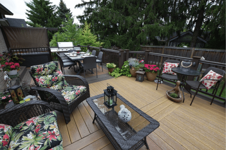 A light and dark wood style vinyl deck with mahogany railings and porch furniture on it in Lebanon PA