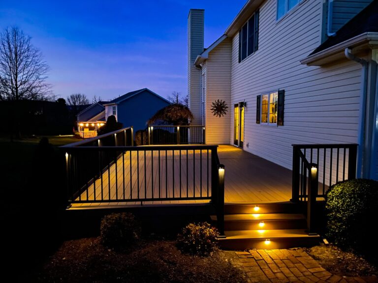 A lit up composite deck at night in Danville, PA by Upper Dauphin Vinyl Products