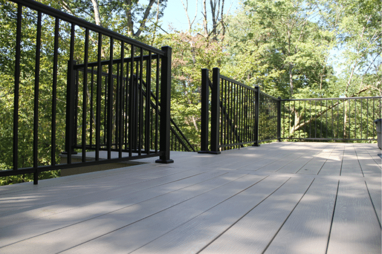 view of composite decking and black railings