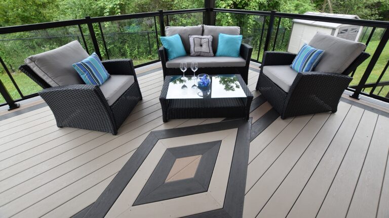 vinyl deck with a diamond design featuring black, brown, and tan vinyl decking as well as three chairs and a table for seating in Lebanon PA